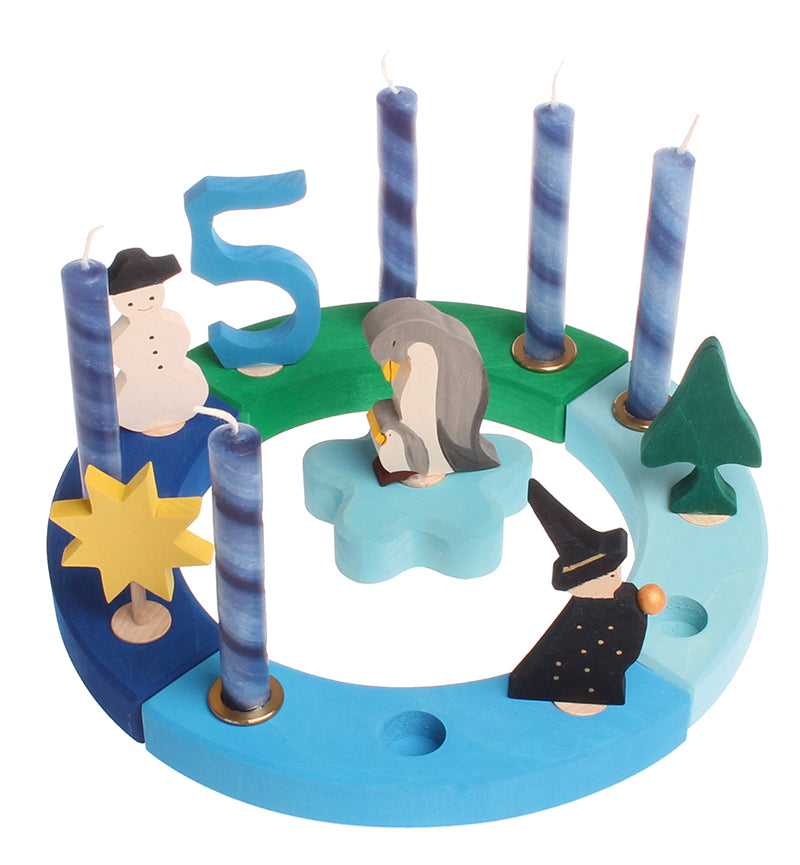 Grimm's 12-Hole Blue-Green Wooden Celebration Ring with 5 blue candles and decorative figures to celebrate a 5th birthday