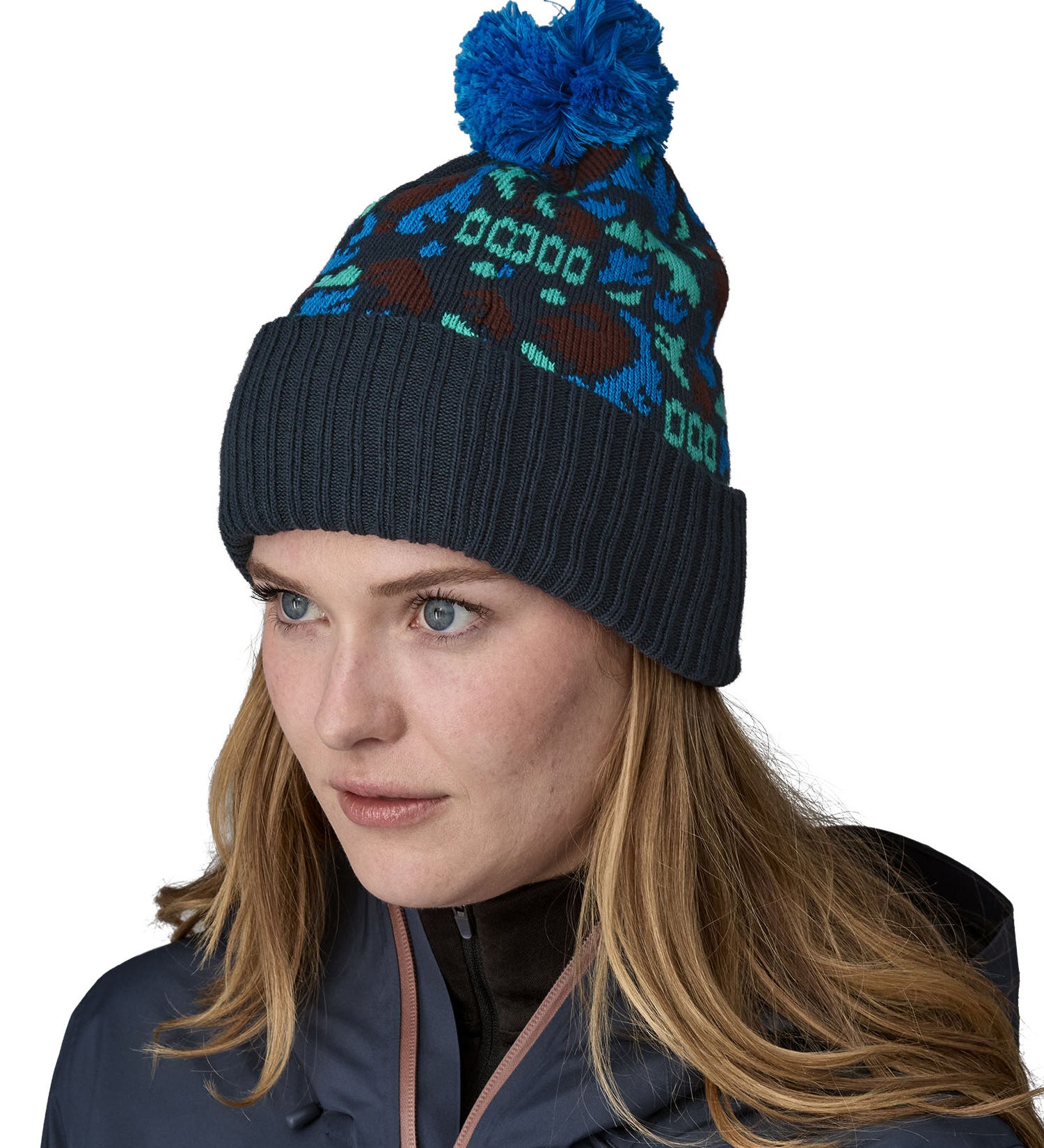 A female adult wearing the blue Patagonia bobble beanie.