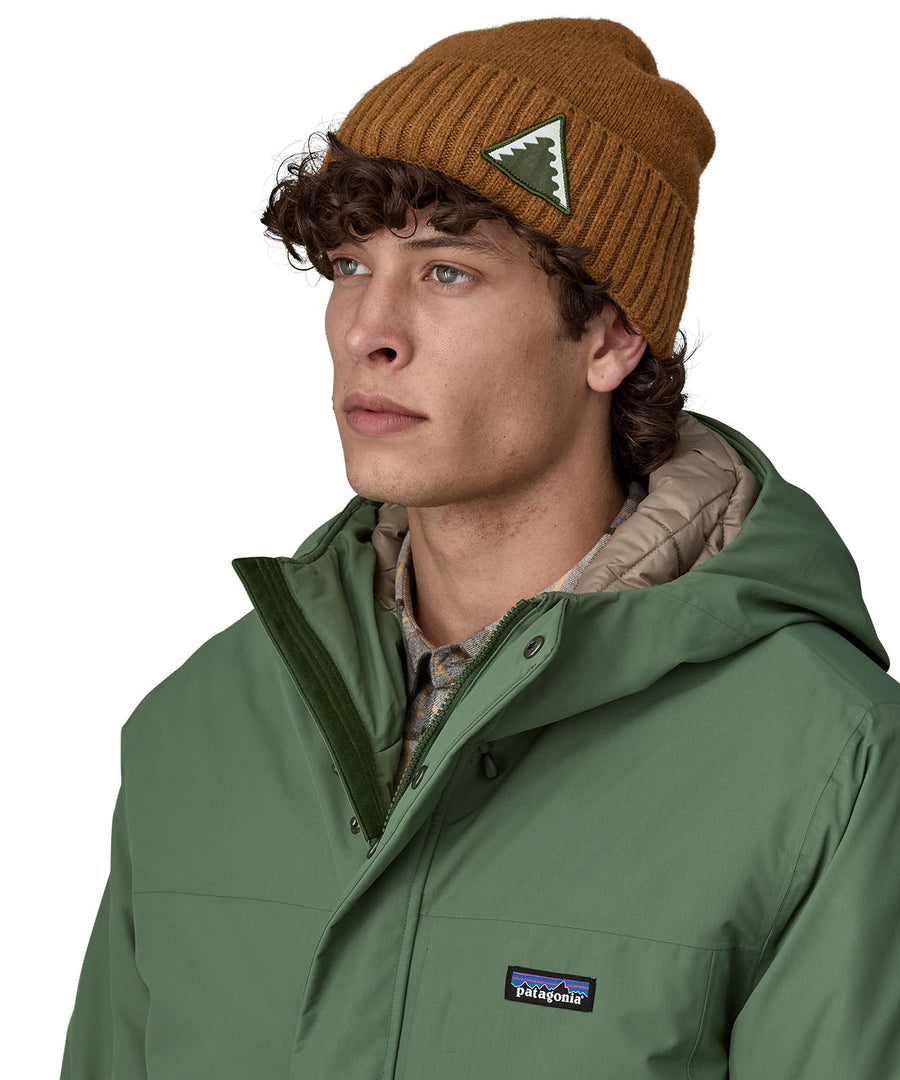 A male adult wearing the brown Patagonia beanie.