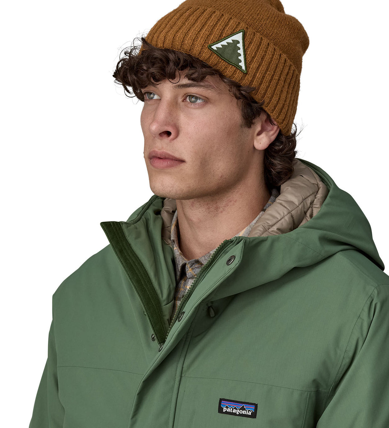 A male adult wearing the brown Patagonia beanie.