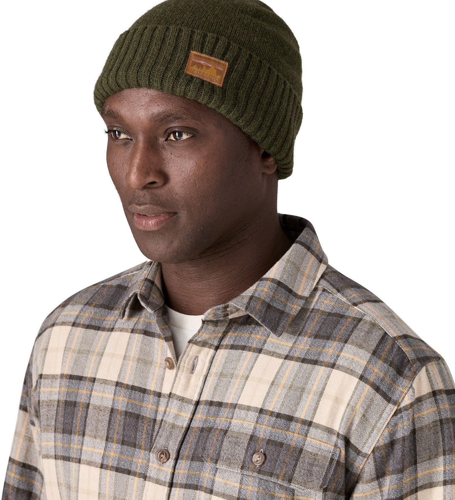 A male adult wearing the green beanie.