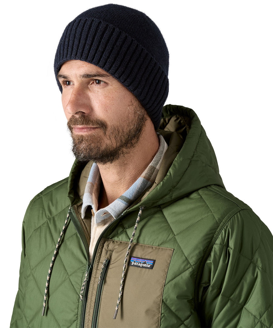 A male adult wearing the Patagonia navy beanie.