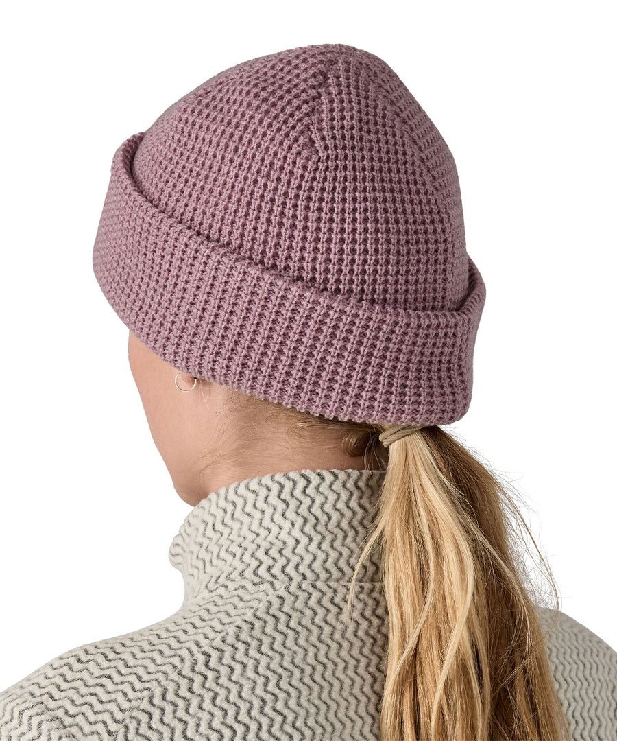 The back of the plain pink Patagonia beanie