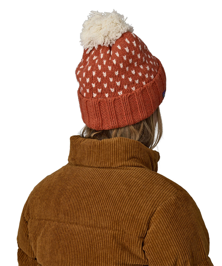 The back of the red and cream bobble Patagonia beanie