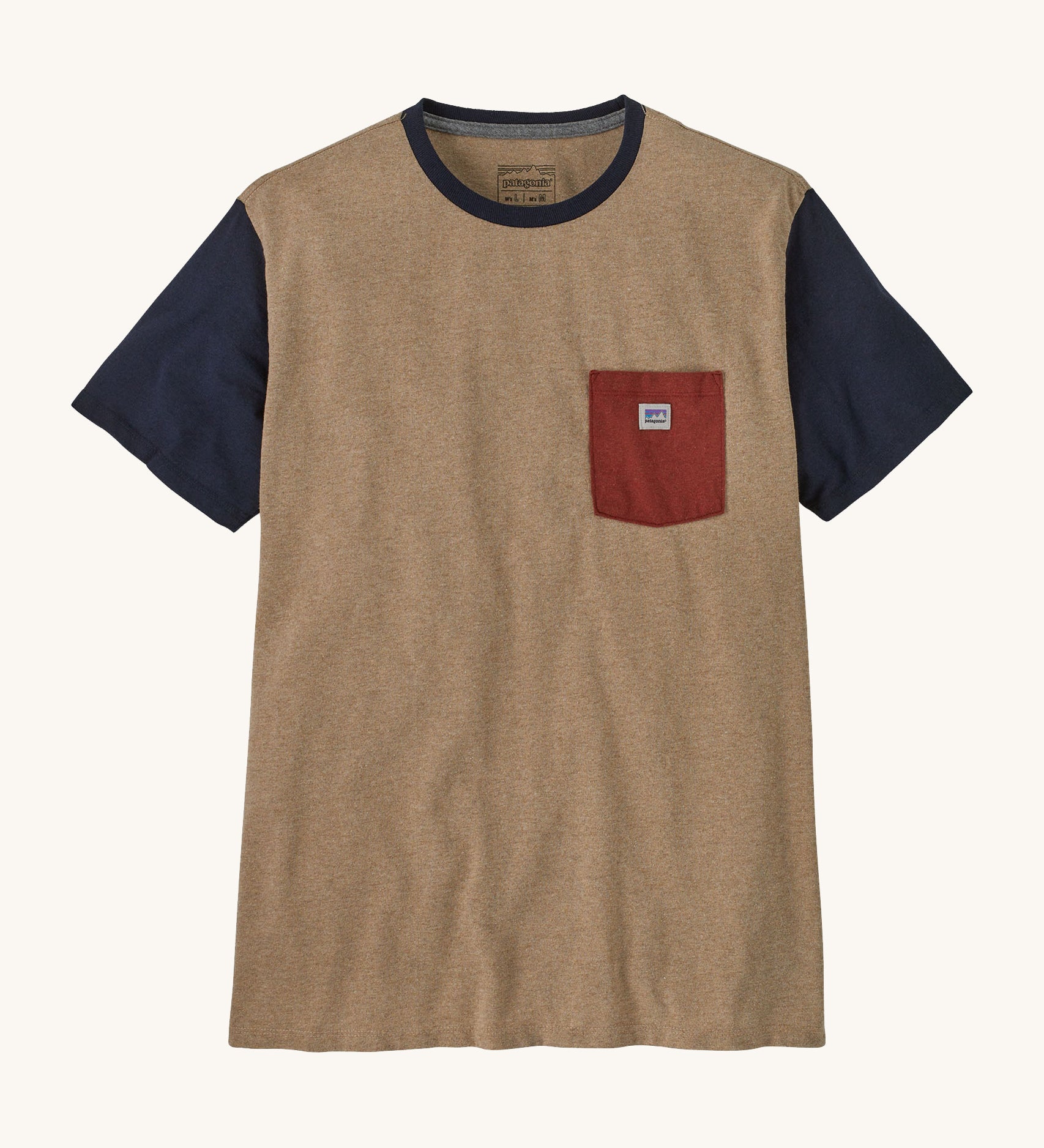 A brown with blue arms Patagonia t-shirt on a cream background.