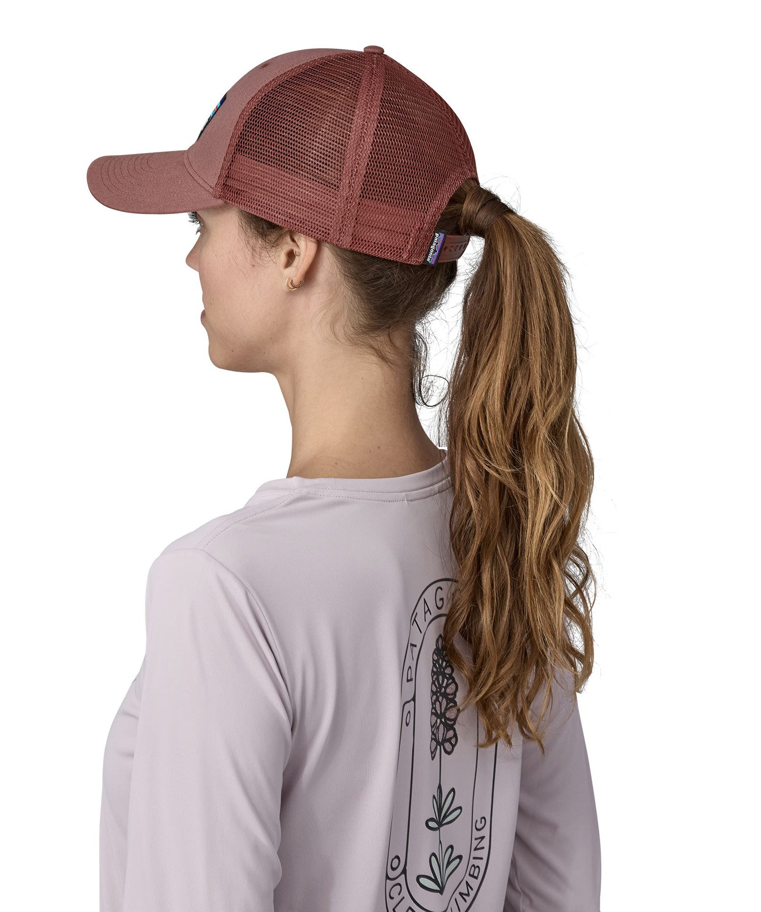 A side view of the pink Patagonia trucker hat