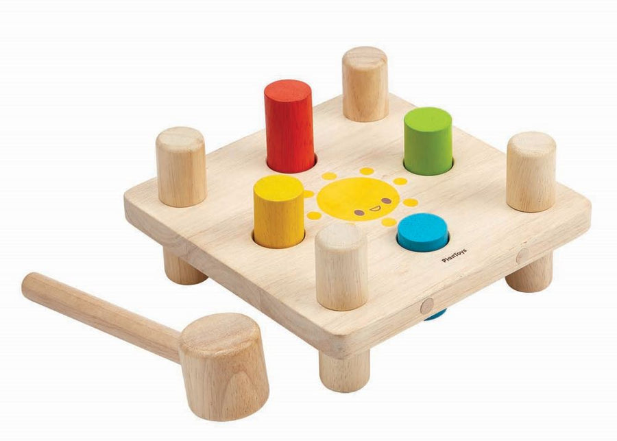 a classic wooden toy hammer bench with colourful pegs for babies and toddlers