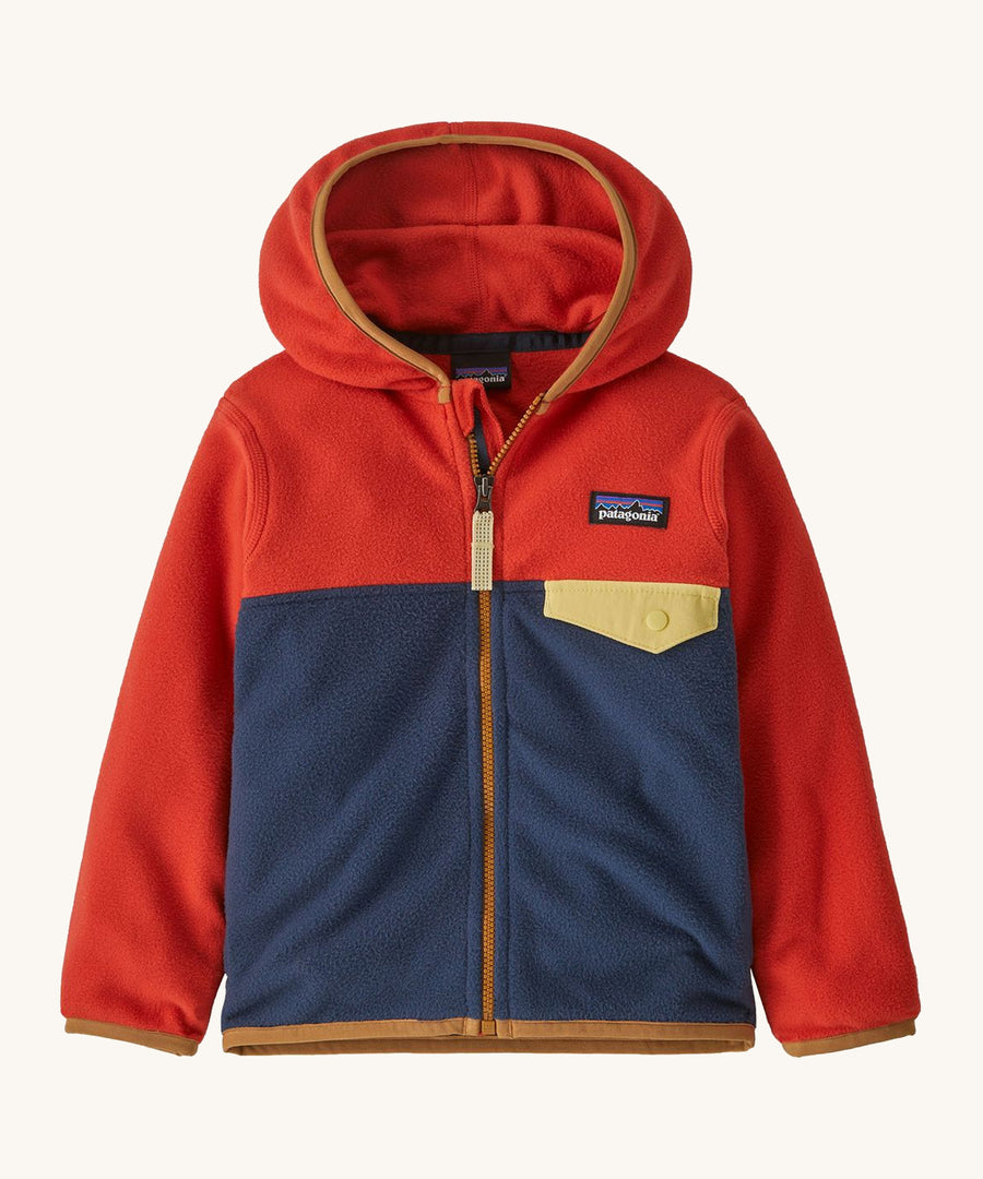 Red and navy kids Patagonia fleece on a cream backgorund