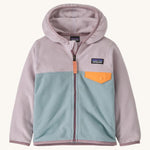 Light pink and blue kids Patagonia fleece on a cream background