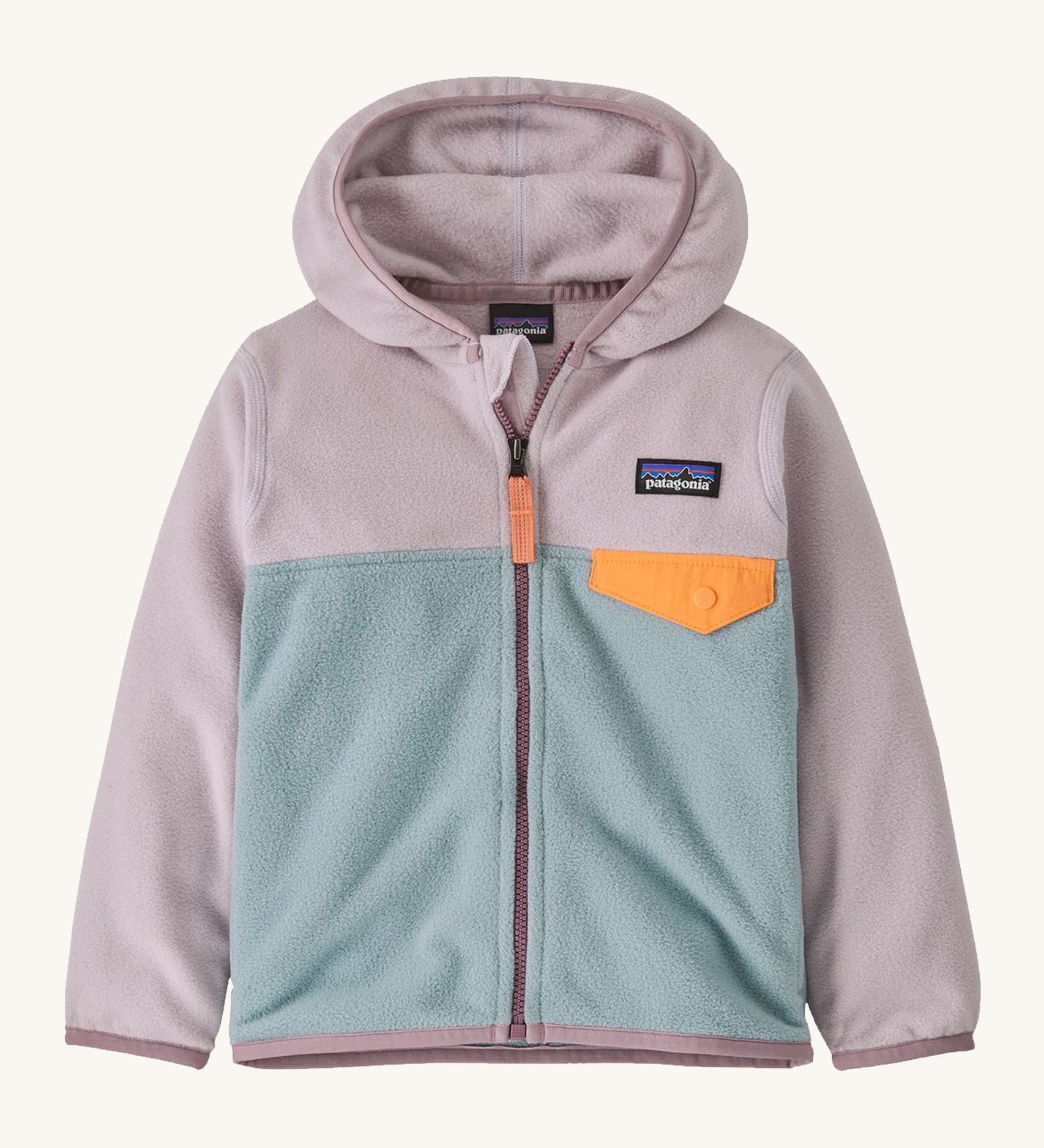 Light pink and blue kids Patagonia fleece on a cream background