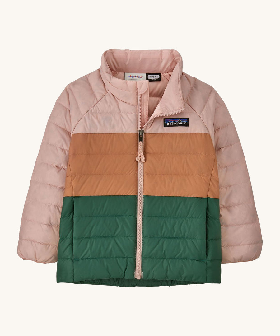 Light pink, brown and green kids Patagonia jacket on a cream background