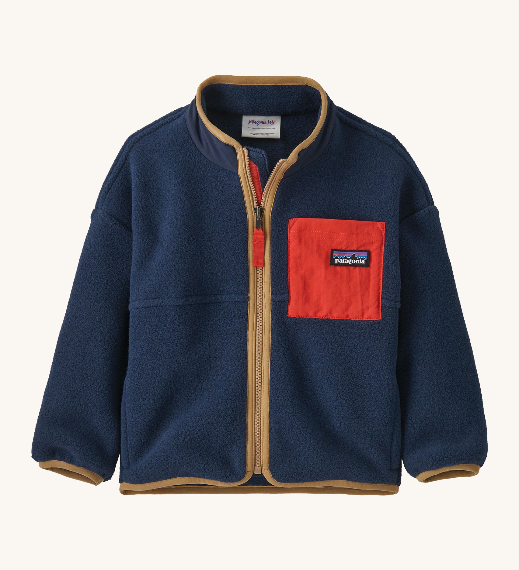 A navy with brown trim Patagonia fleece on a cream background