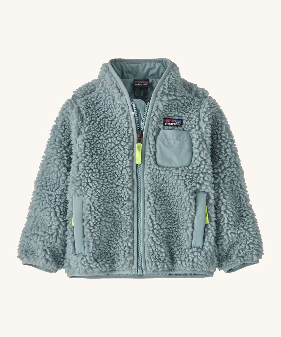 Light blue Patagonia fleece on a cream background