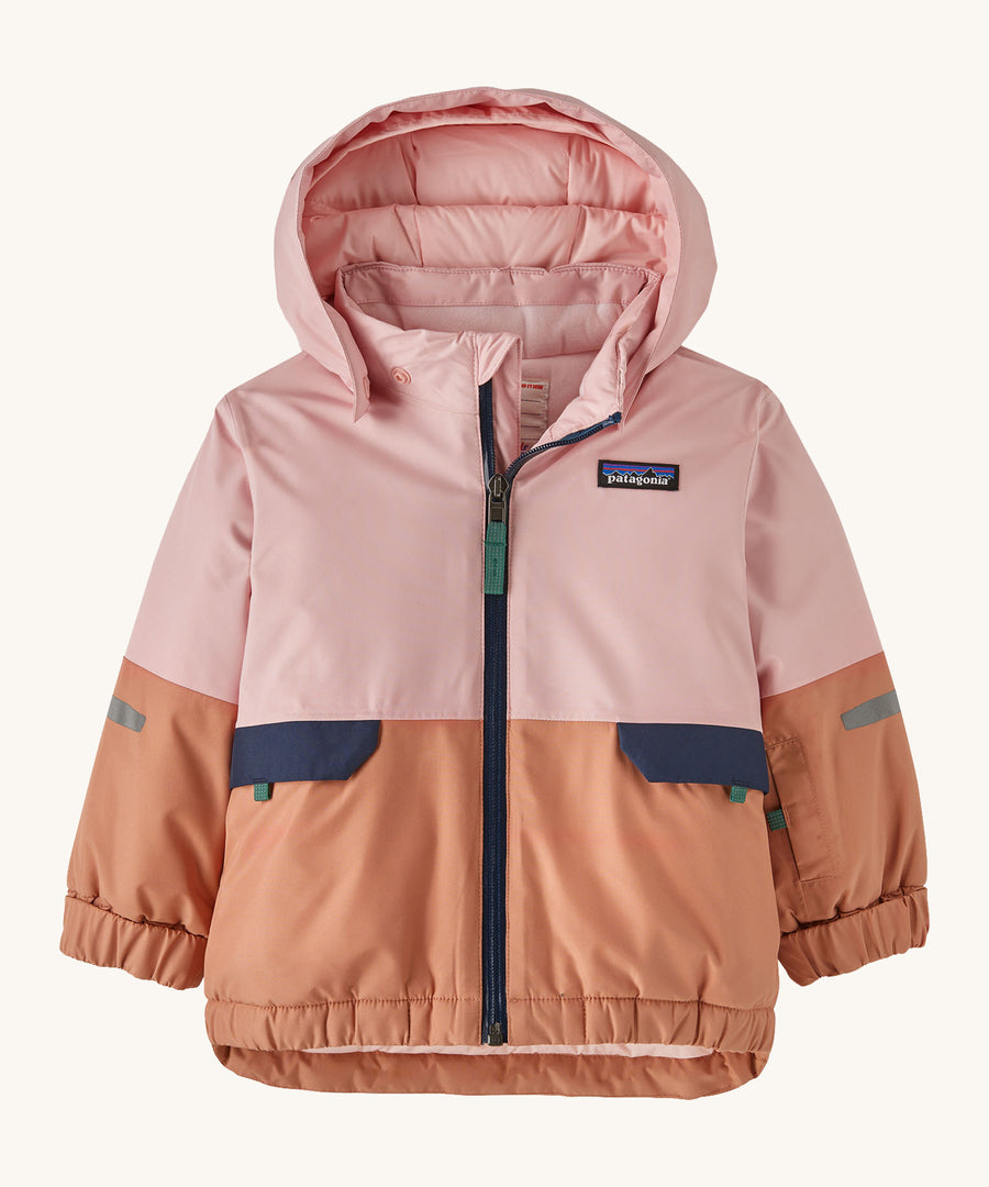 A light pink and orange hooded snow jacket on a cream background