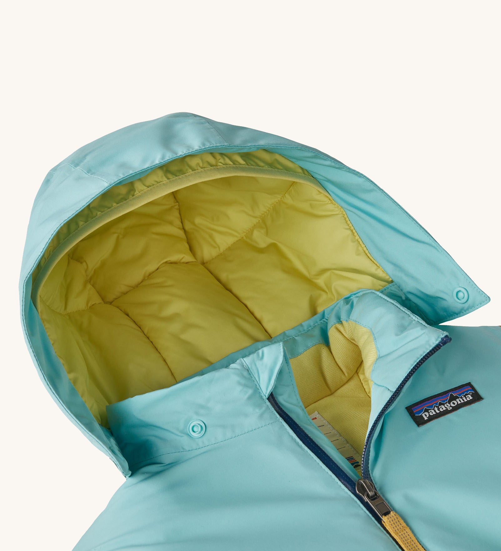 A close up of the hood on the all in one snowsuit