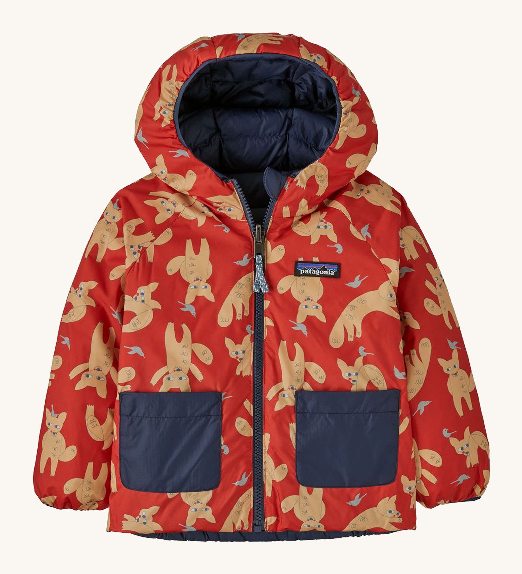 The reversible fox print Patagonia jacket on a cream background