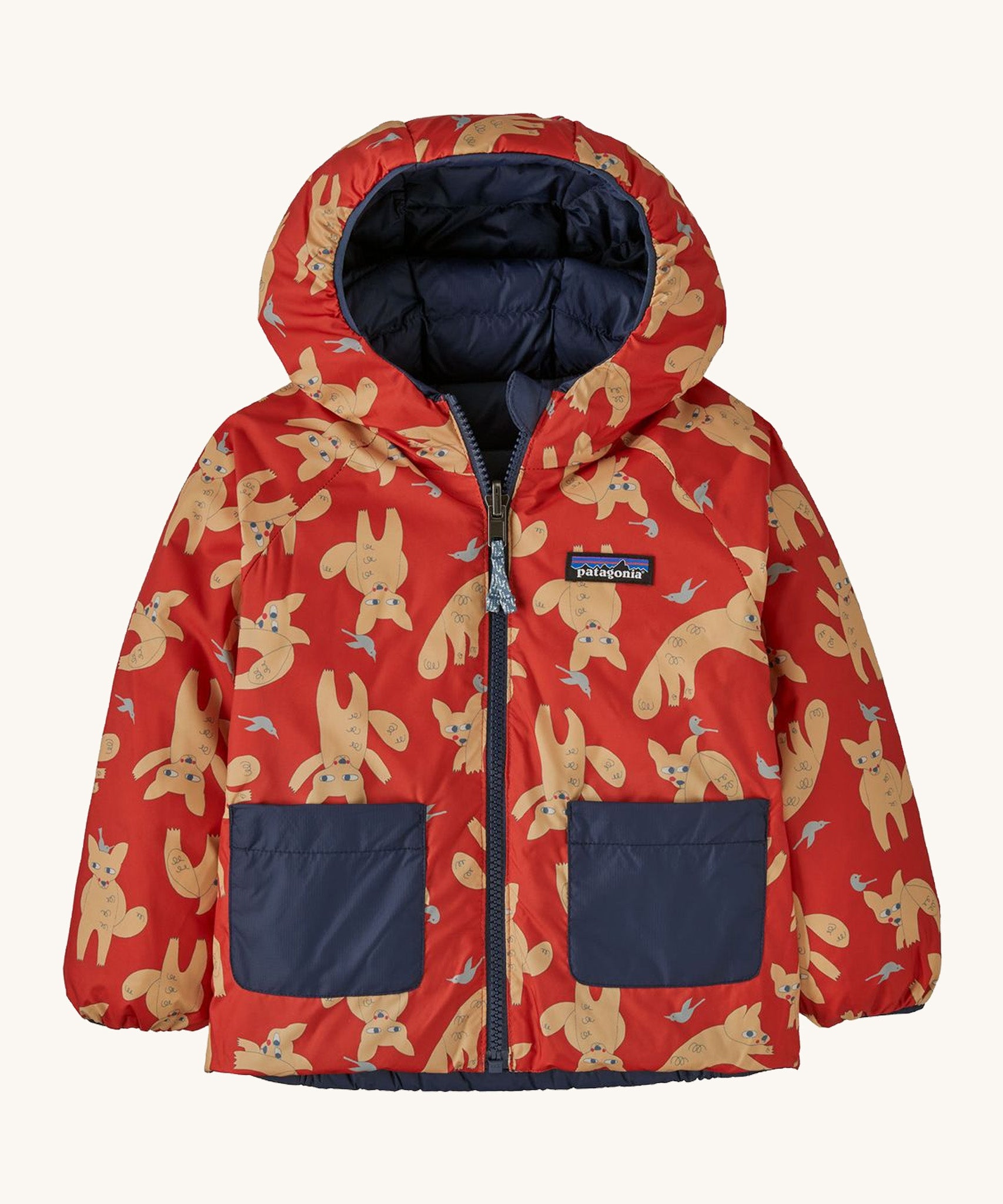 The reversible fox print Patagonia jacket on a cream background