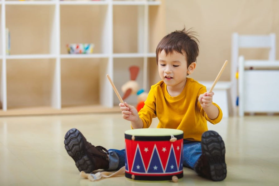 Plan Toys Big Drum II with a red and blue zig zag pattern