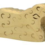 Holztiger mouton couché