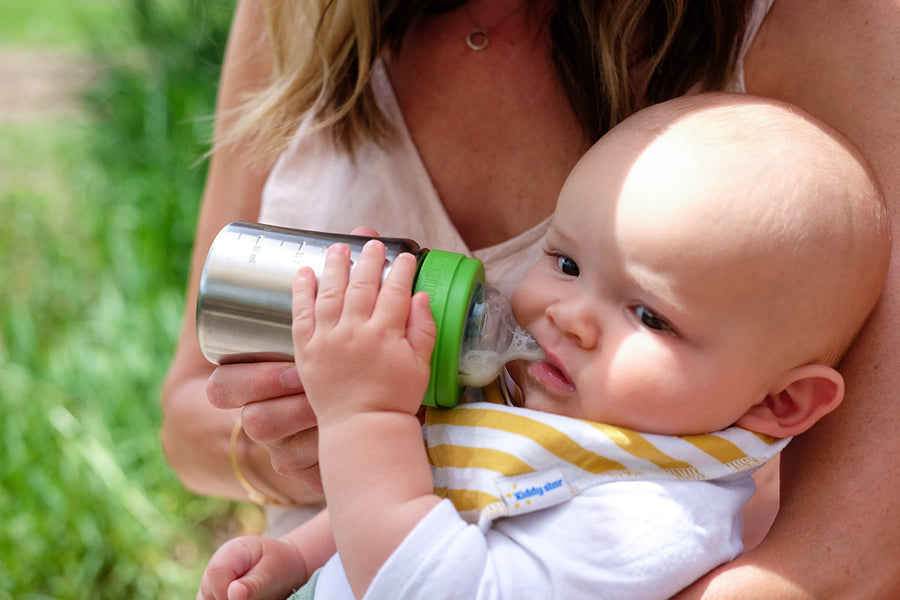 Close up of baby drinking from the Kid Kanteen 9oz baby bottle