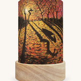 The Autumn Courage illustration by Kapitein Kalk sat in a Toverlux Magic Lantern base, on a cream background