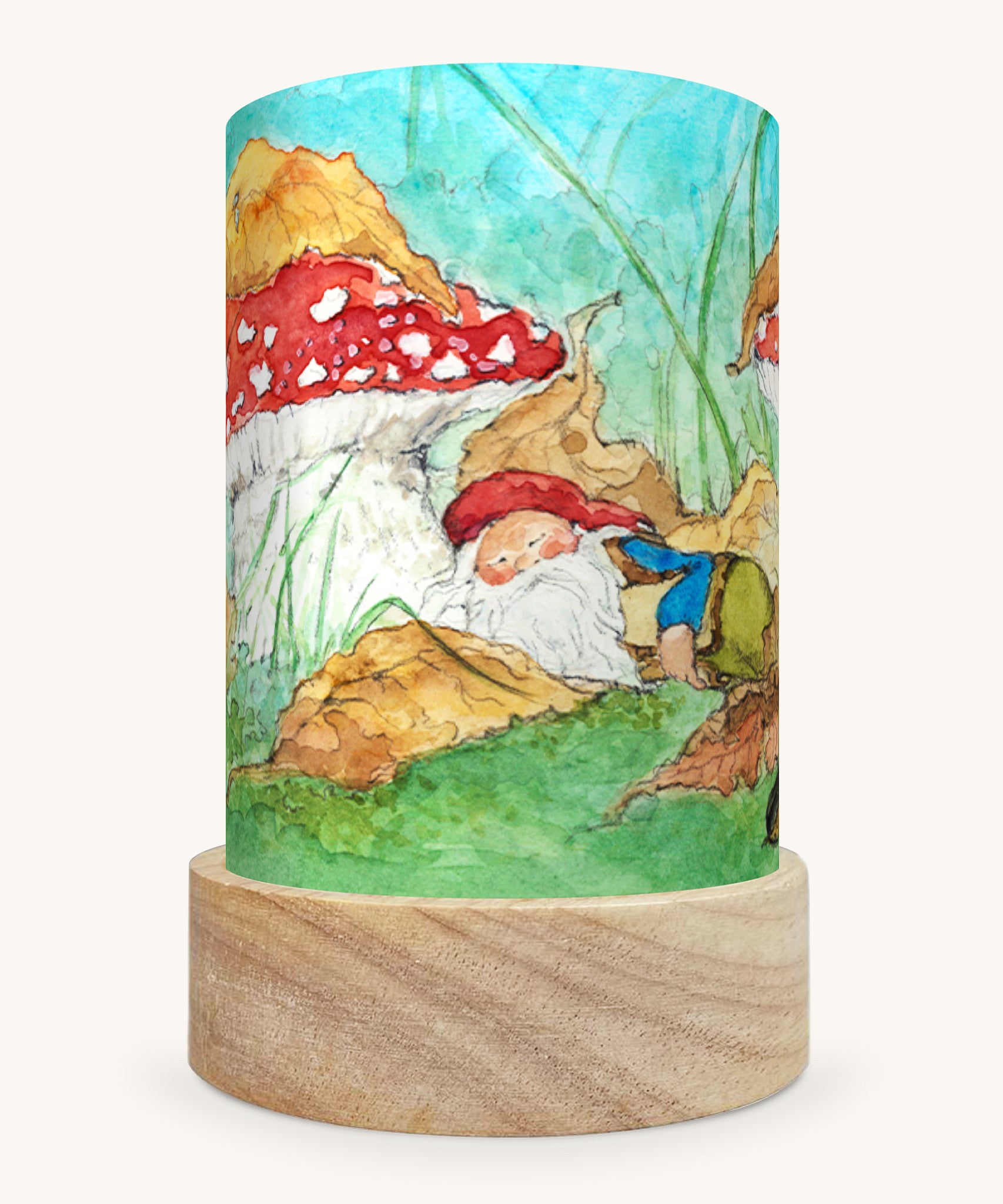 The Autumn Gnome illustration by Eentje Van Margo sat in a Toverlux Magic Lantern base, on a cream background