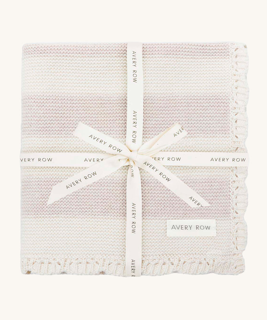 Avery Row Stripe Knit Organic Baby Blanket - Oat Melange, a knitted white and oatmeal stripe baby blanket wrapped in a branded gift ribbon. 