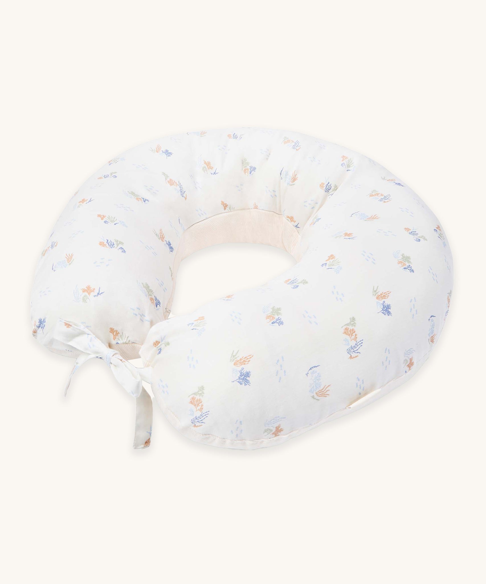 Avery Row Nursing Pillow - Coastline, a white nursing pillow with a delicate seaweed print in muted tones. 