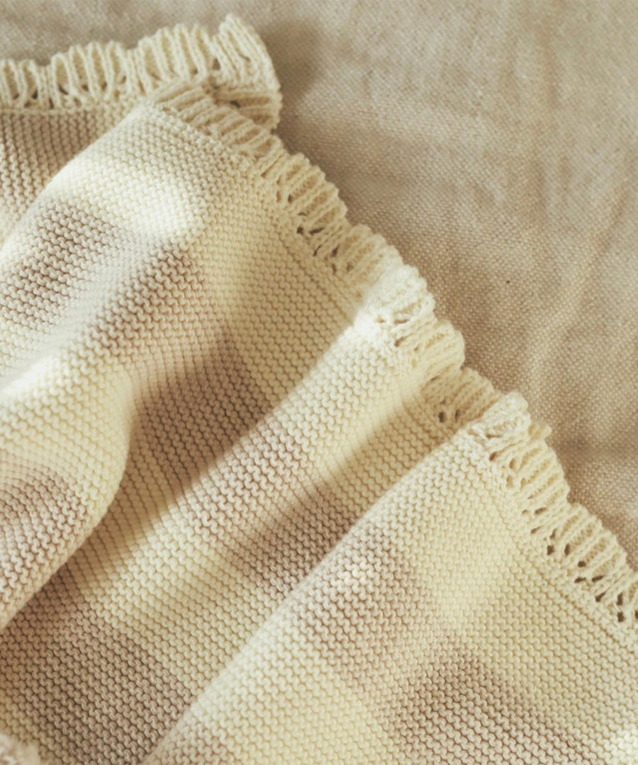 Avery Row Stripe Knit Organic Baby Blanket - Oat Melange, closer details of the knitted stripe pattern and scalloped edge. 