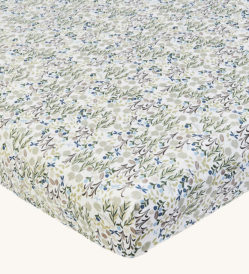 Avery Row Cotbed Fitted Sheet - Riverbank. A light cream sheet with beautiful and delicate Riverbank print