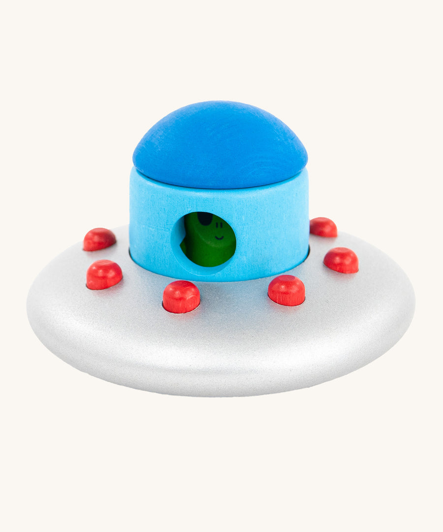 The Bajo Alien Flying Saucer is a fun, kids stacking or stand alone toy, with a silver spaceship with red dots, a blue top and a little green alien inside.