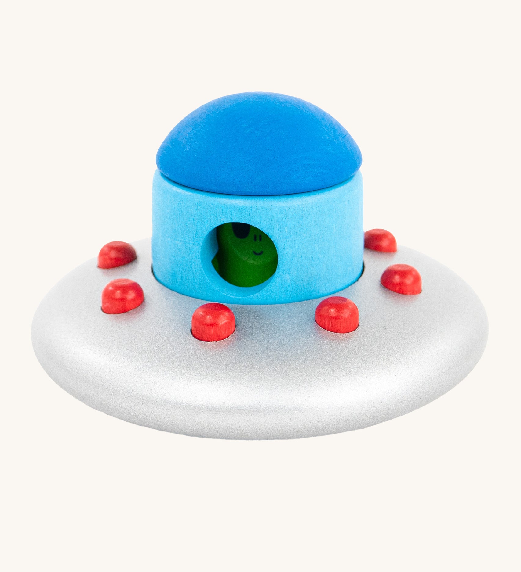 The Bajo Alien Flying Saucer is a fun, kids stacking or stand alone toy, with a silver spaceship with red dots, a blue top and a little green alien inside.