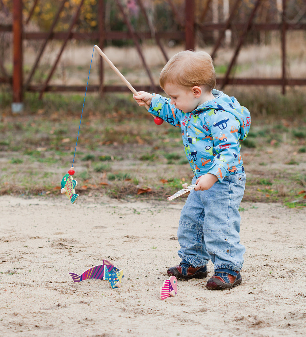 A child playing with the Bajo Magnetic Fishing Game 