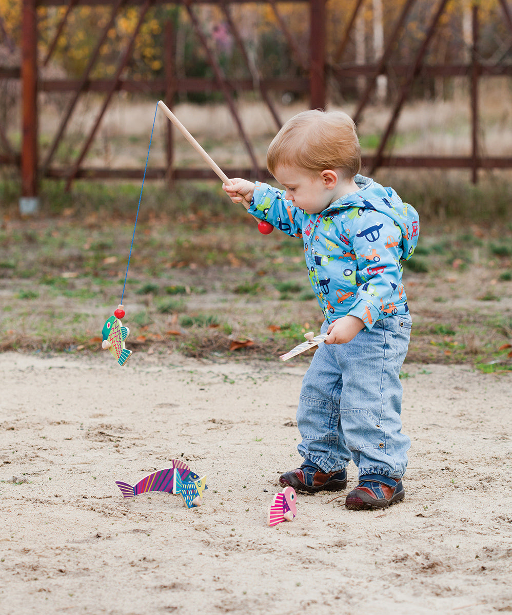 A child playing with the Bajo Magnetic Fishing Game 