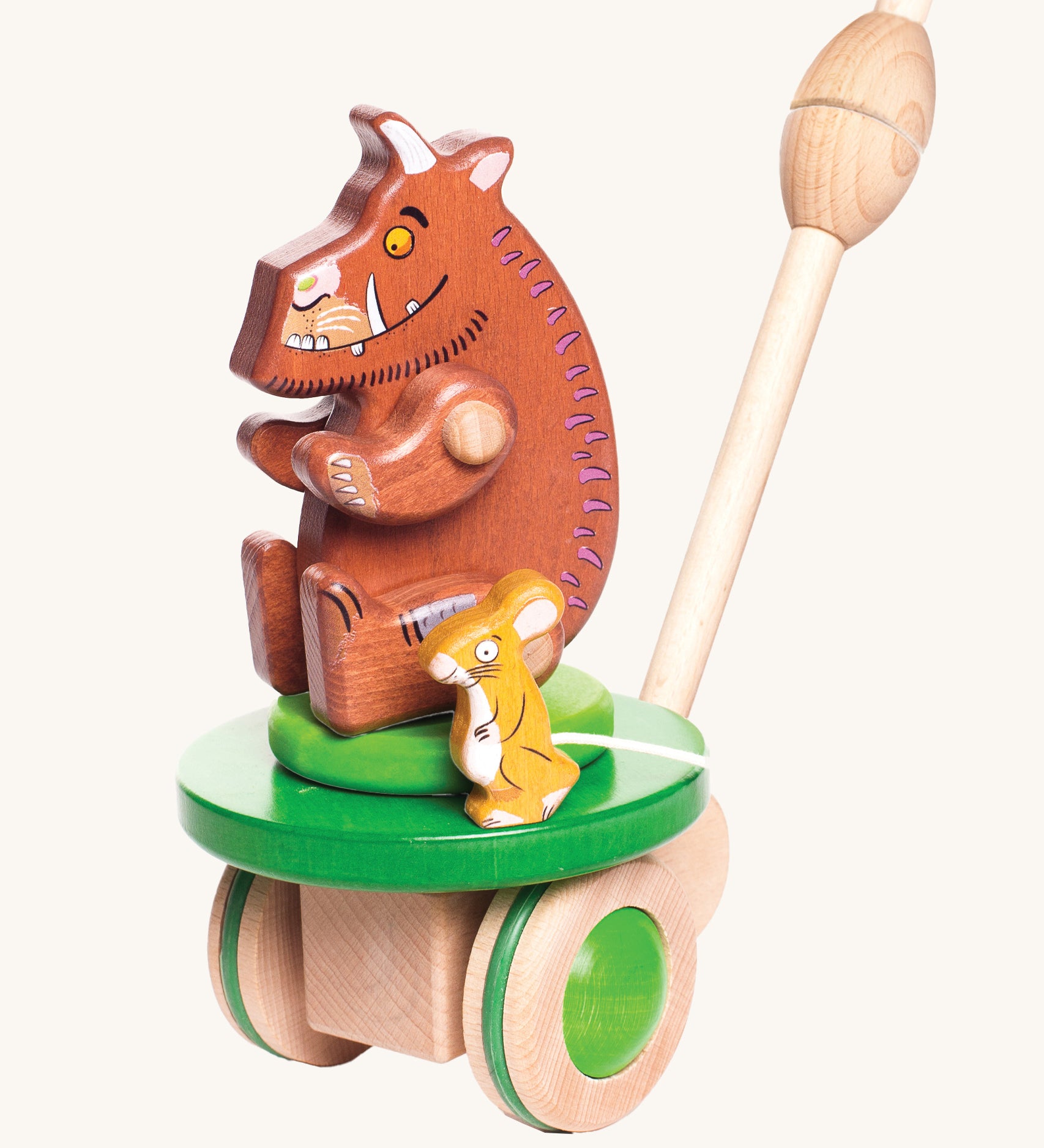 Bajo Gruffalo & Mouse Push Along toy is a wooden two-in-one toy for toddlers, including the Gruffalo and Mouse figures. The section where the brown Gruffalo and mouse are sat moves round and round, and the wooden Gruffalo toy can be removed from this section