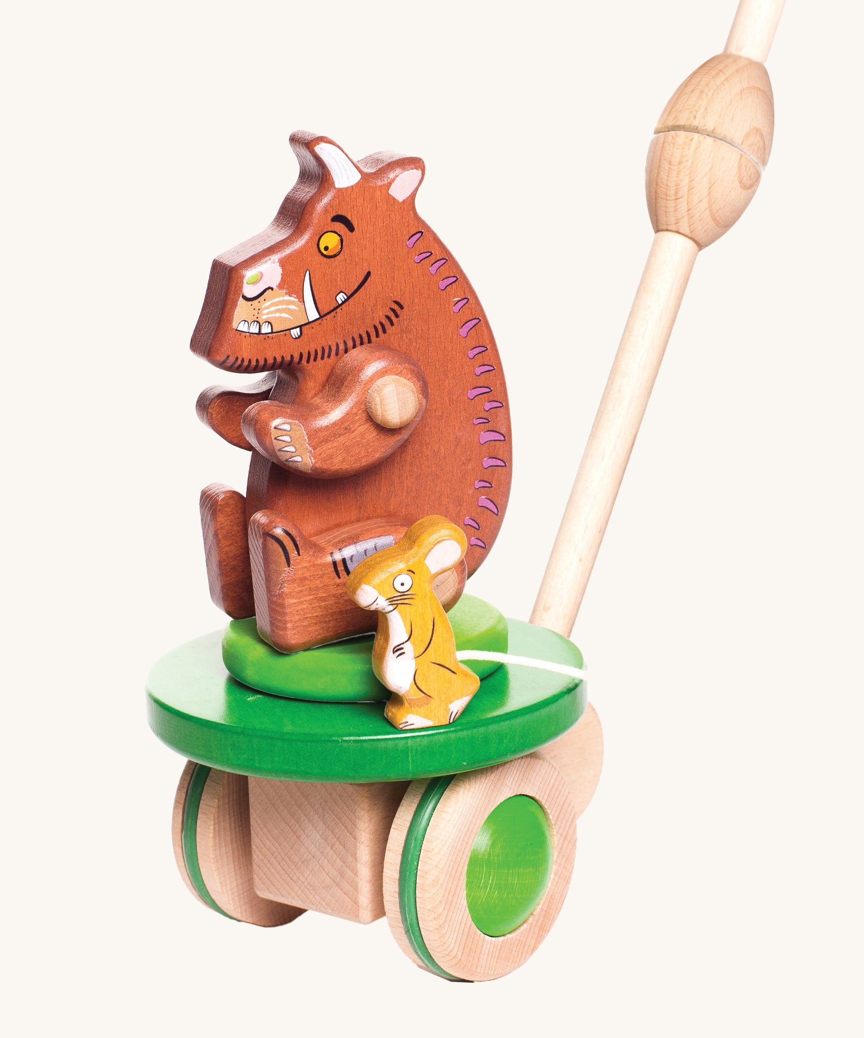 Bajo Gruffalo & Mouse Push Along toy is a wooden two-in-one toy for toddlers, including the Gruffalo and Mouse figures. The section where the brown Gruffalo and mouse are sat moves round and round, and the wooden Gruffalo toy can be removed from this section