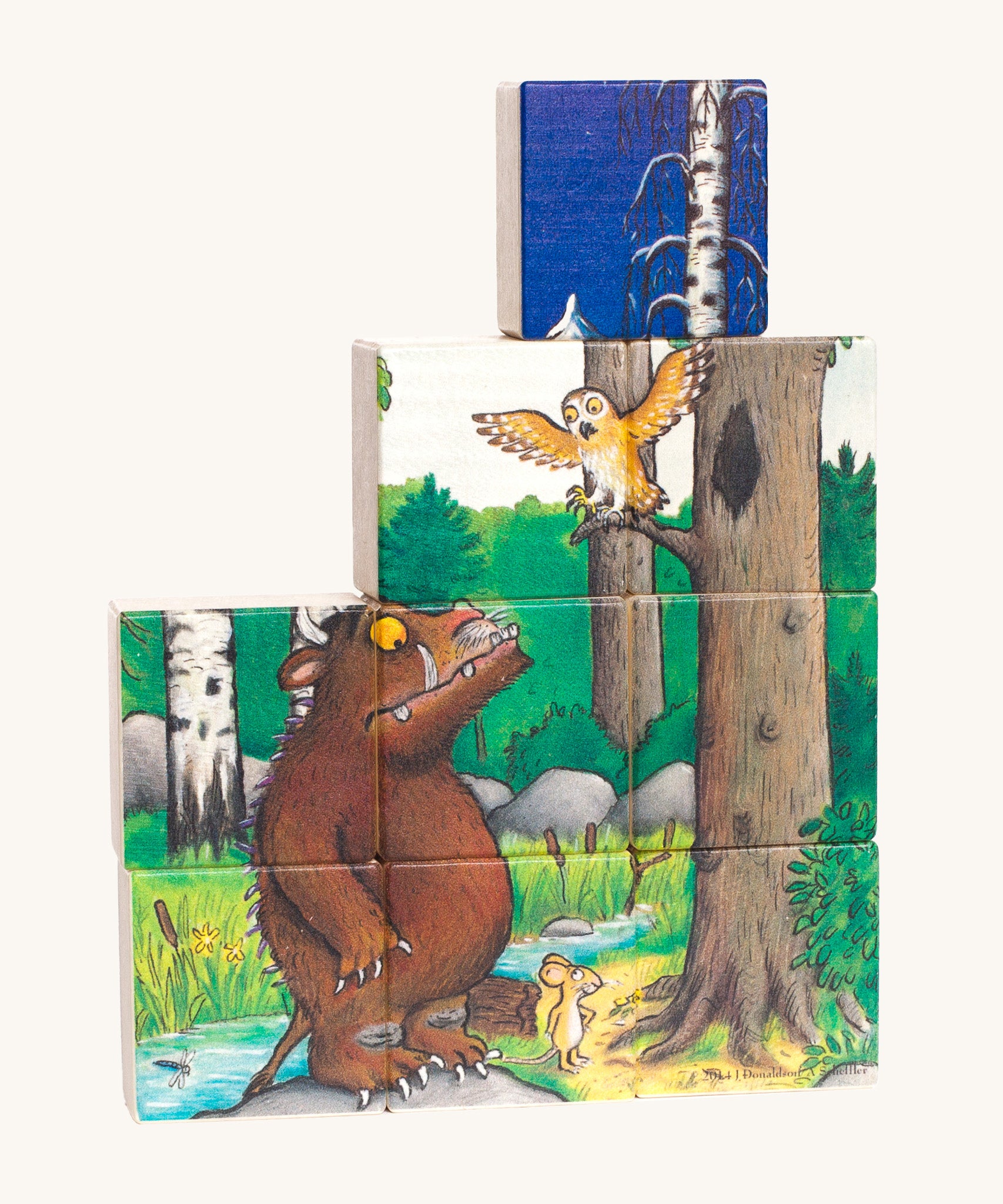 One side of the Bajo Gruffalo Wooden Block Puzzle showing a woodland scene of the Gruffalo and Owl, with a blue block on top showing the other side of the puzzle blocks