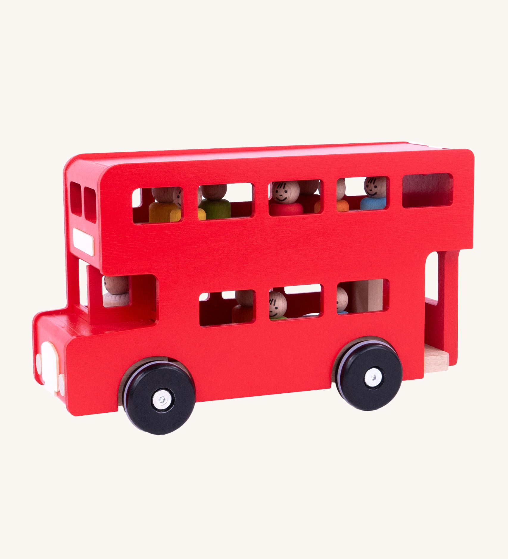 A side image of the red wooden Bajo London Bus, showing the colourful peg doll passengers and a wooden driver inside