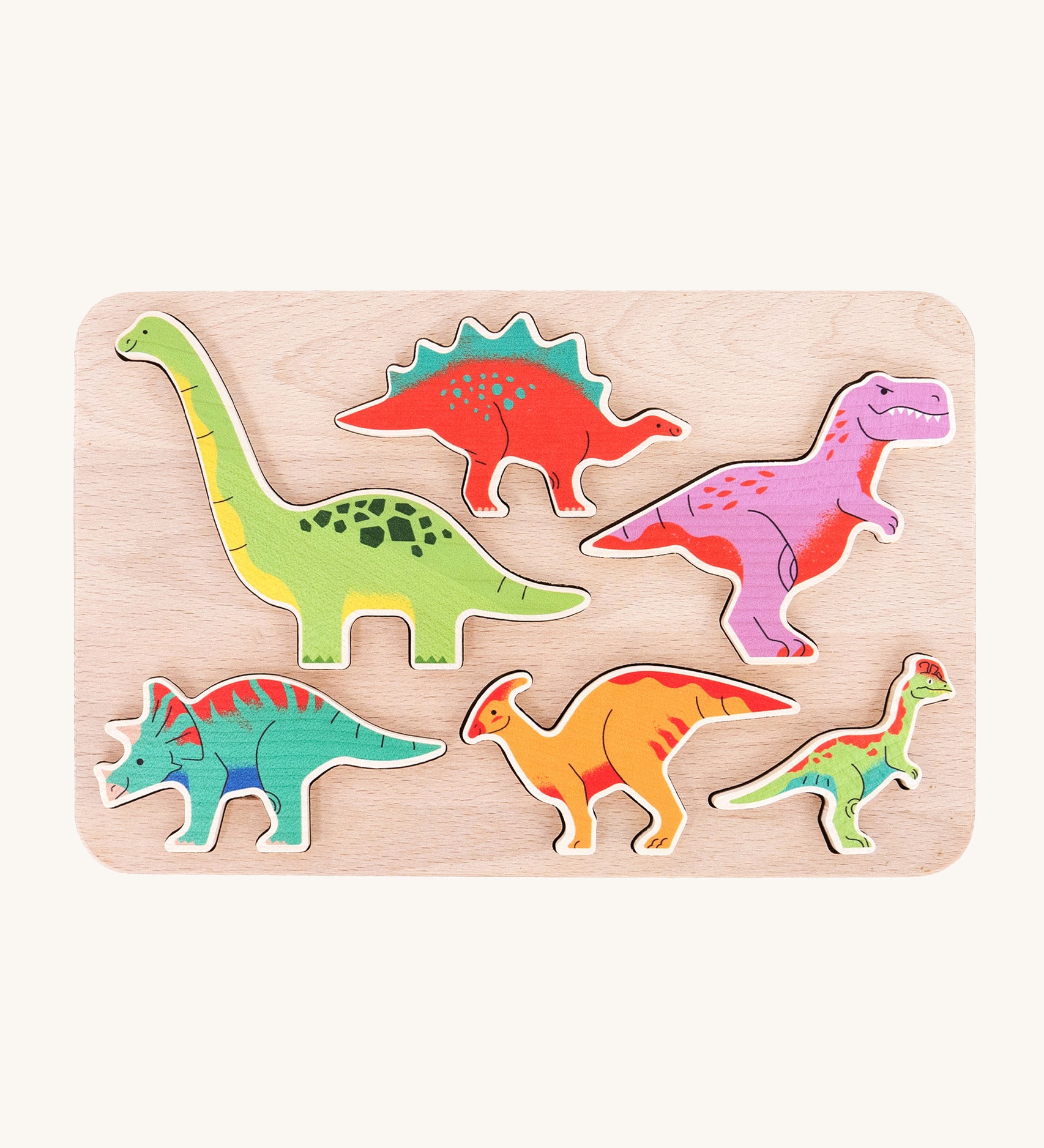 The Bajo Wooden Dinosaur Puzzle, has 6 colourful wooden dinosaurs that slot into a light wooden base. The pieces can also be used as a stand alone in Jurassic play scenes. The image is taken from a top down view to show the dinosaurs in their base 