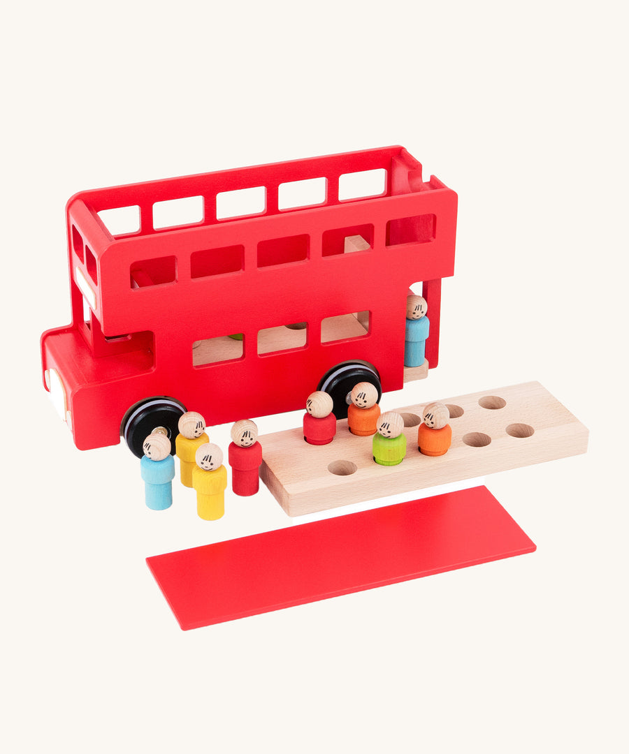 A top view of the Bajo Red London Bus, showing the roof and first floor removed to show how little ones can put the peg doll passengers inside. On a cream background