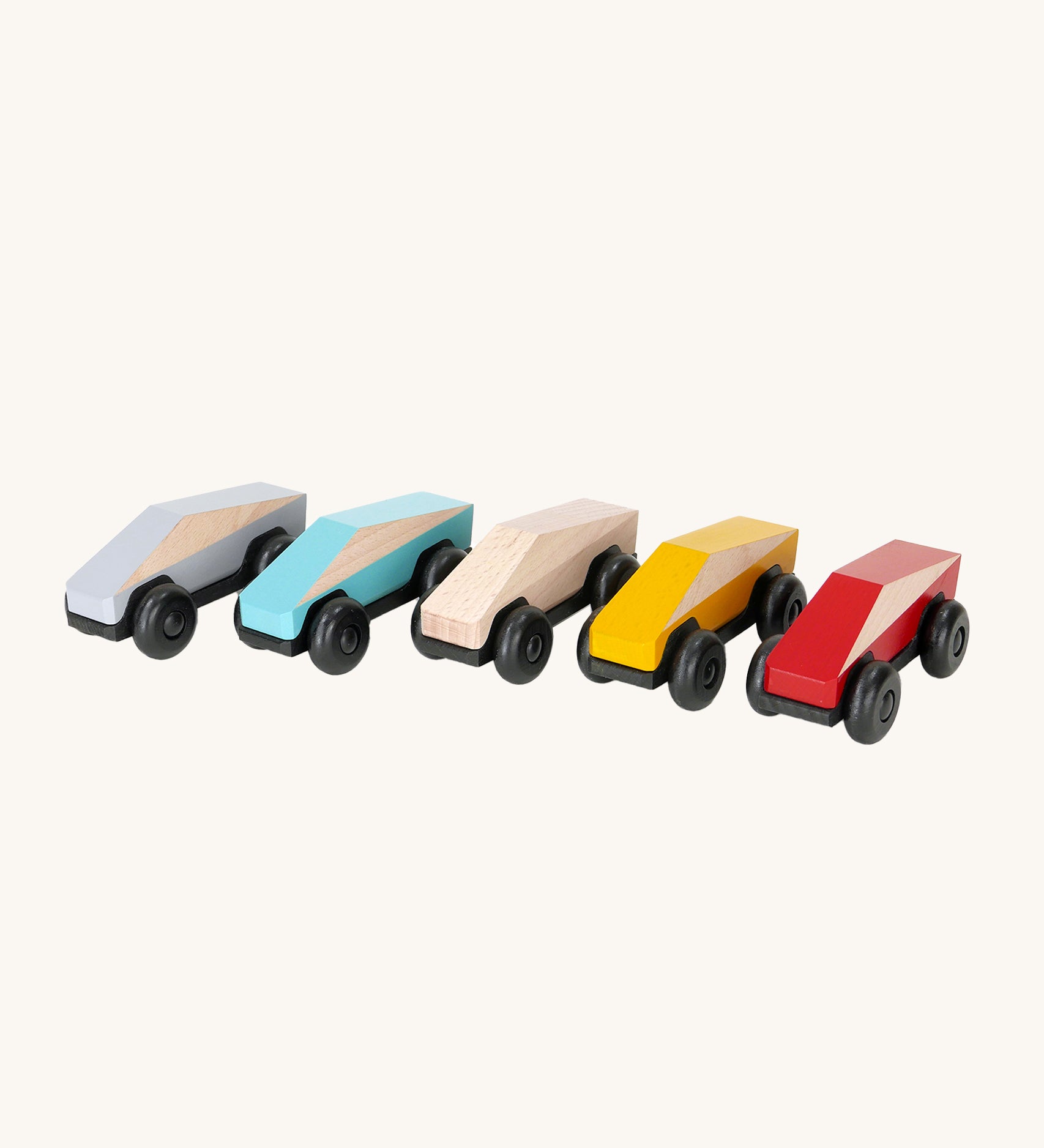 The Bajo Tobe Poly cars, in a row on a cream background