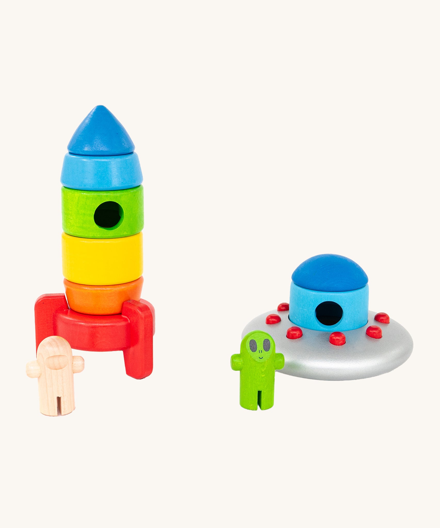 The alien has met an astronaut! The Bajo Alien Flying Saucer is stood next to a Bajo Rocket with rainbow colours, with the alien and astronaut stood outside of their spaceships