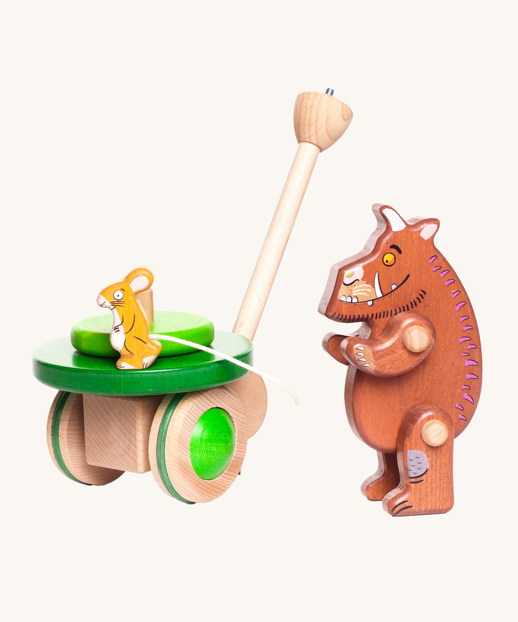 The Wooden Gruffalo figure is stood next to the Bajo Gruffalo & Mouse Push Along Toy and is looking at the mouse