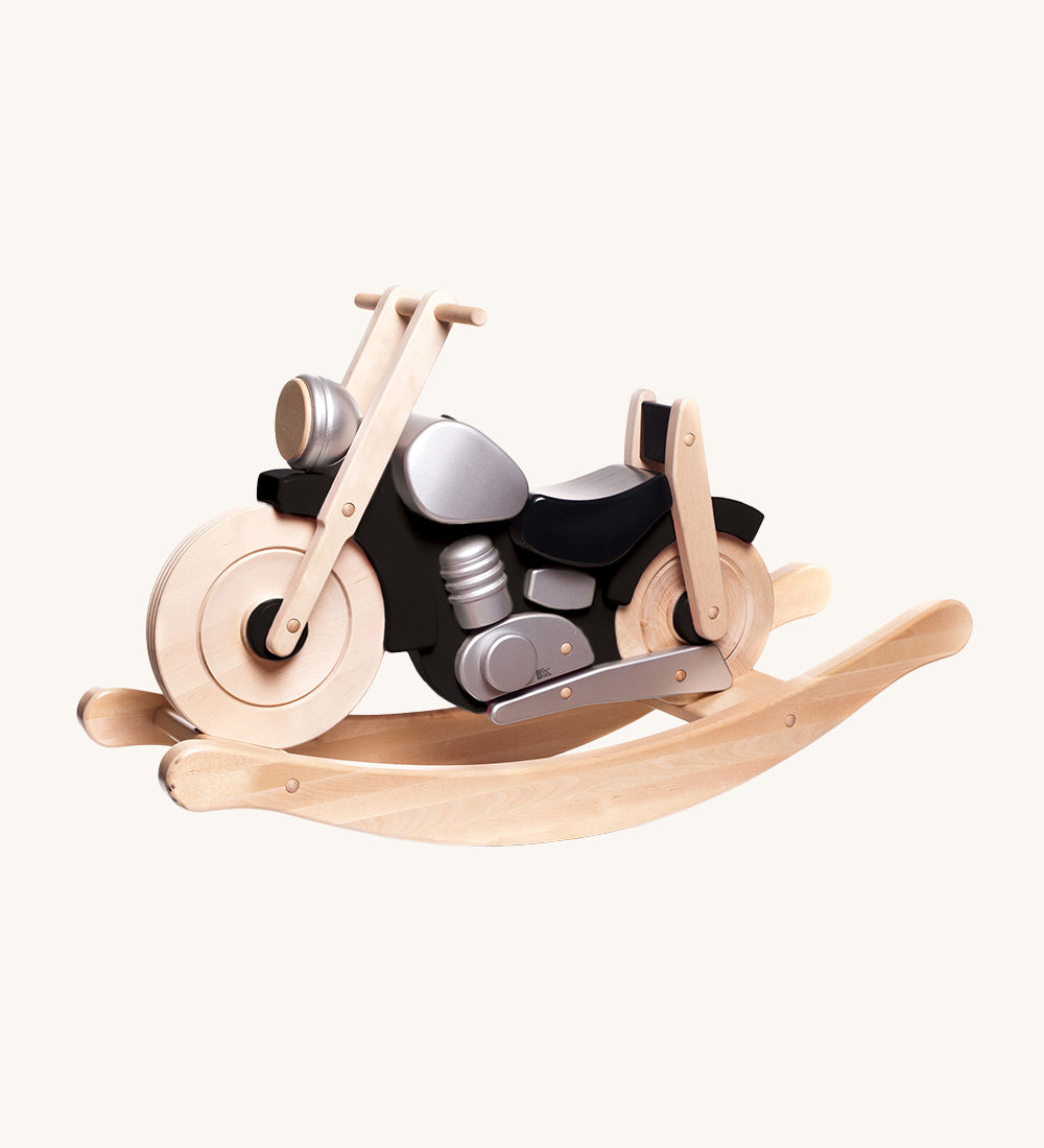 Bajo Rocking Motorbike - Black, is a large ride-on wooden motorcycle with a black body, silver detailing and natural wood rocking arches. Designed to be sat on and ridden, this toy bike is perfect for imaginative and creative play