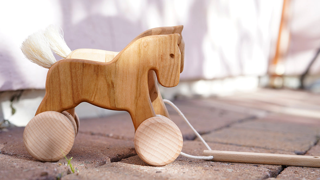 Bajo wooden toy horse on wheels