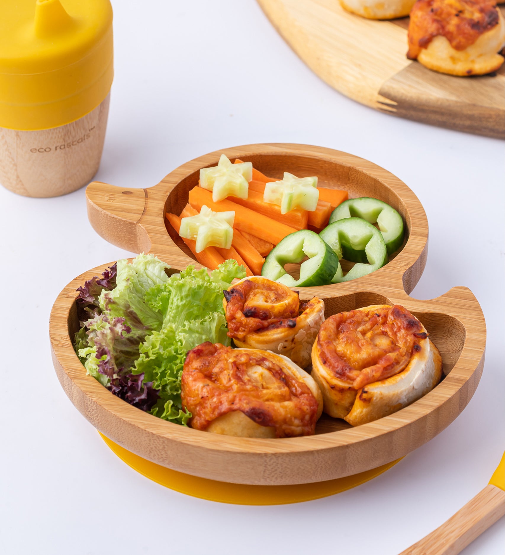 Eco Rascals Duck Bamboo Suction Plate, with carrot sticks, salad and pastry swirls. 