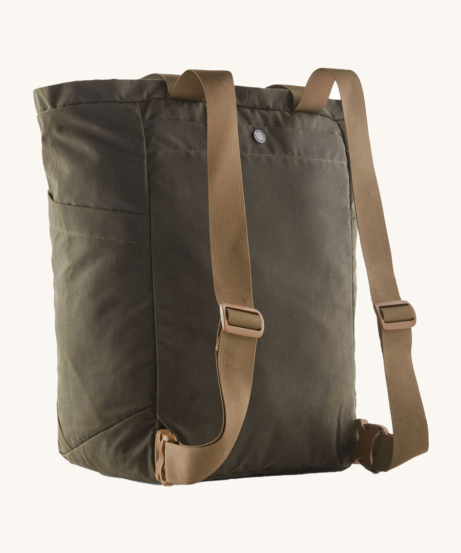 The back of the Patagonia Waxed Canvas Tote Pack Basin Green, showing the shoulder straps