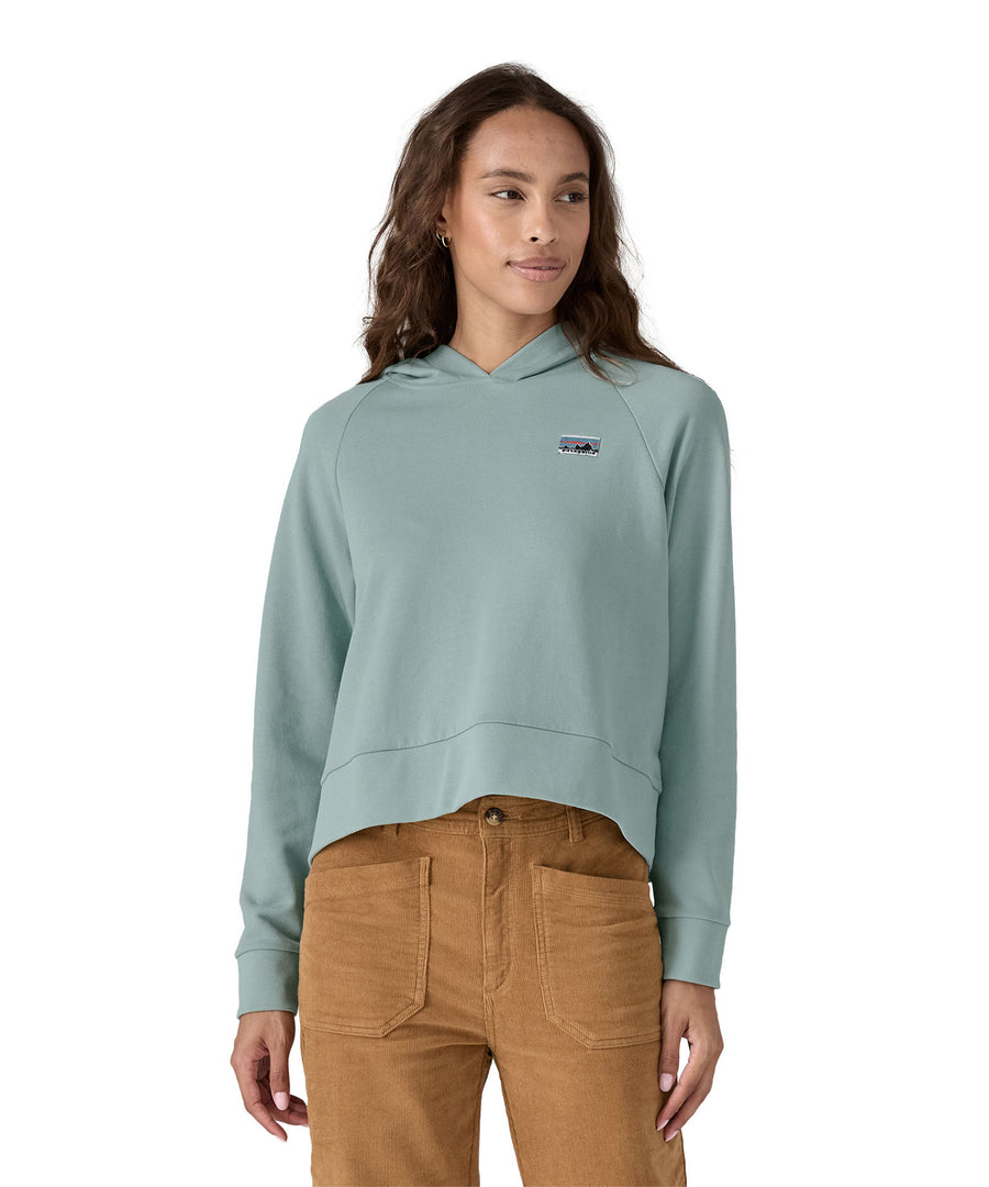 A person wearing the Patagonia Women's Regenerative Essential Hoody in light blue