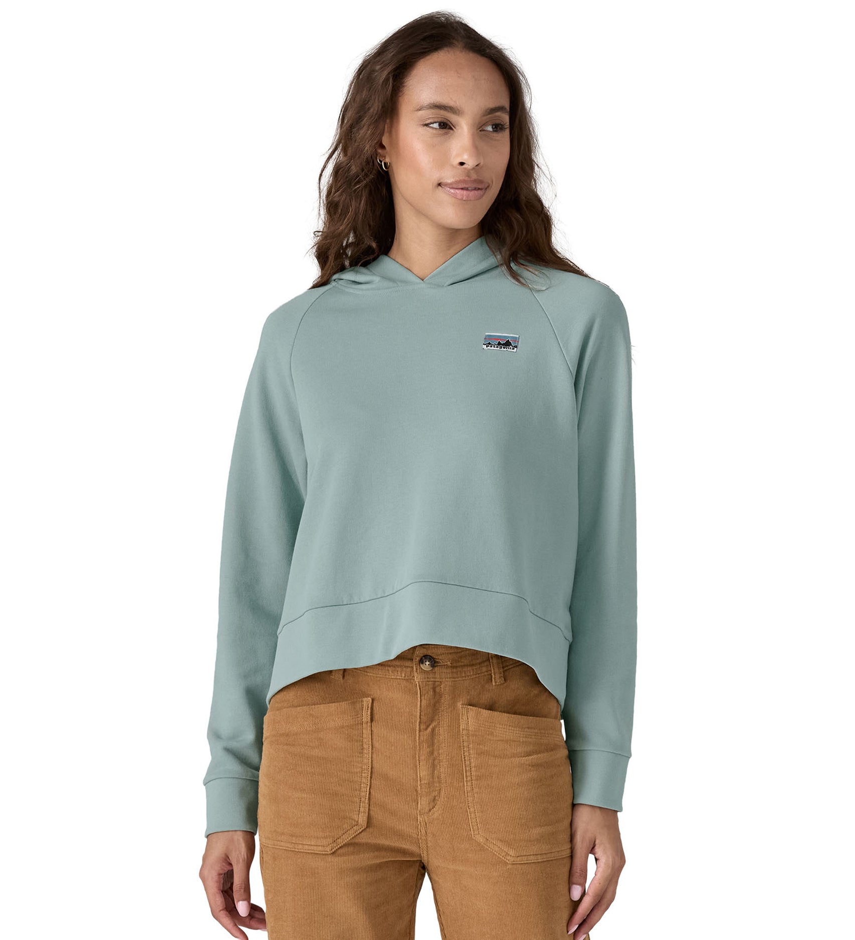 A person wearing the Patagonia Women's Regenerative Essential Hoody in light blue