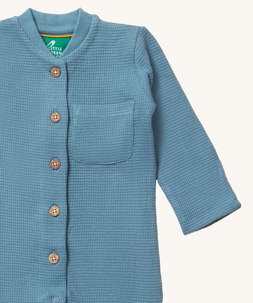 A closer look at the waffle texture fabric, button and pocket on the LGR Waffle Playsuit - Dreamy Blue